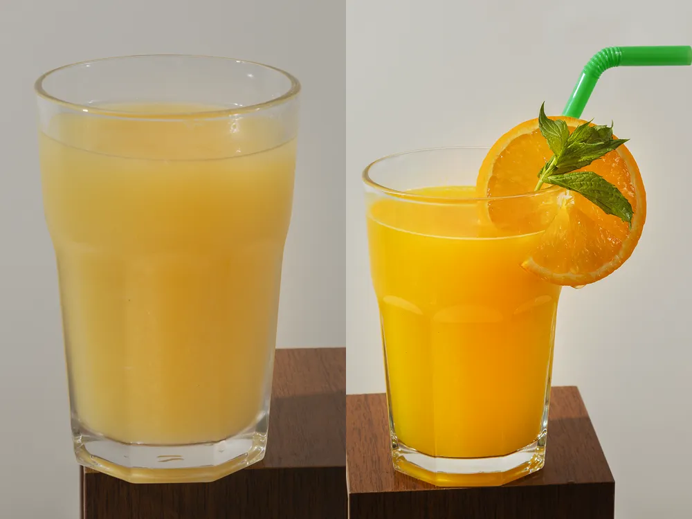 Limonade mit Milch und frisch gepresster Orangensaft von HR Italy: zwei Gläser auf Holzsockeln